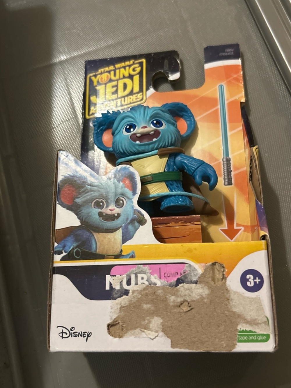 Hasbro Blue Nubi Figure with Cream Outfit and Green Belt